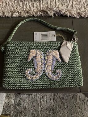 The Sak Sage Green Woven Wristlet with Embroidered Twin Seahorses